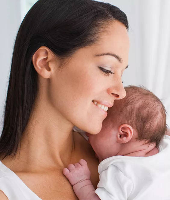 Mother holding her new born baby